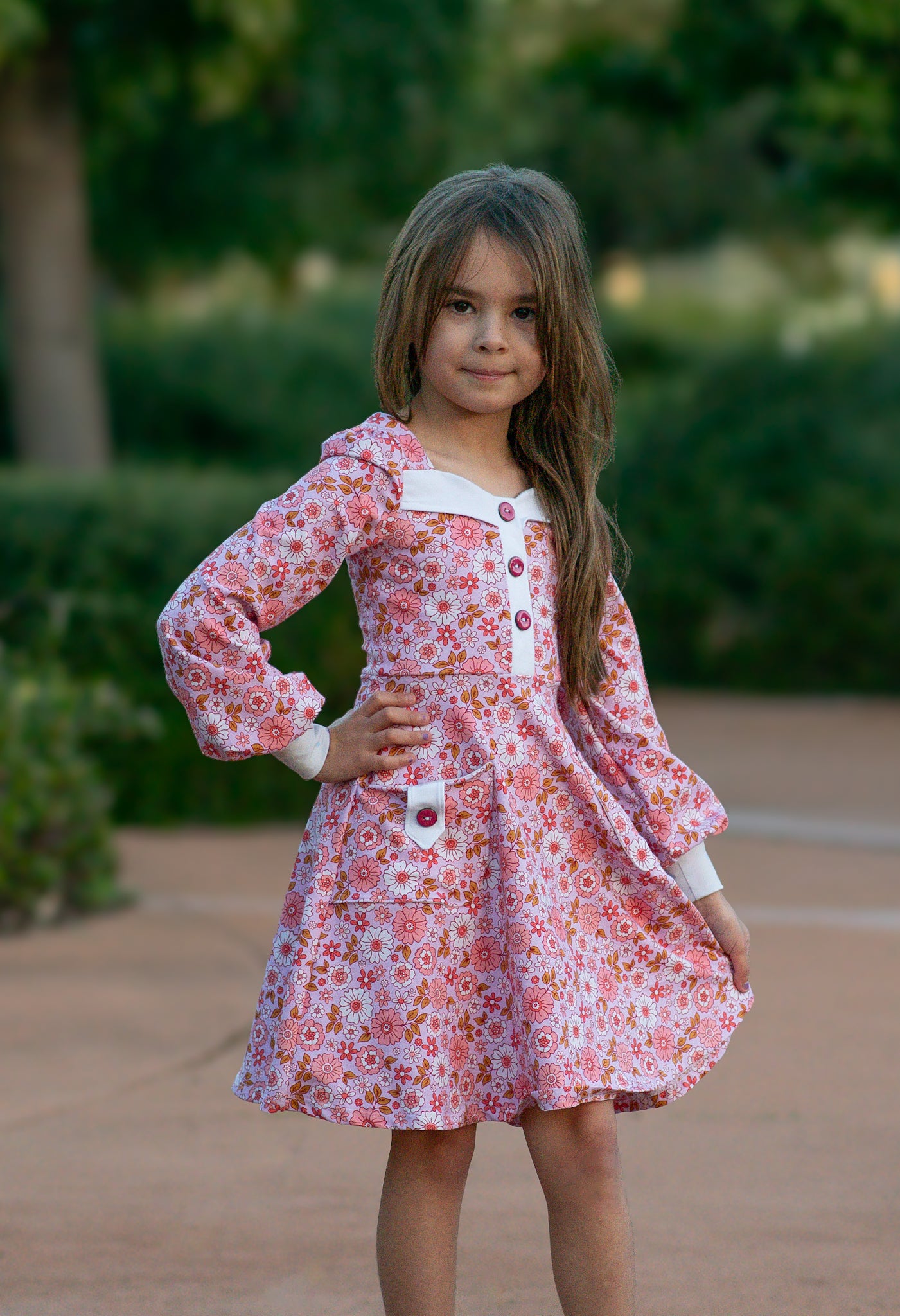 Little lady wearing a light blue vintage dress with a floral pattern, long sleeves pdf pattern