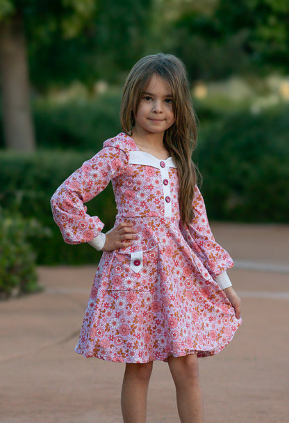 Little lady wearing a light blue vintage dress with a floral pattern, long sleeves pdf pattern
